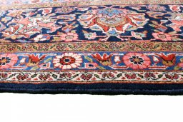 Backside of handmade 1930s Kashan rug showing knot structure and weave density