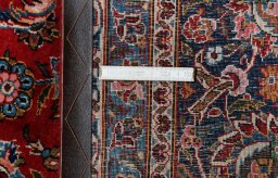 Close-up detail of 1970s Kashan rug from Iran / Persia showing Wool weave