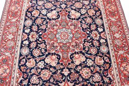 Backside of handmade 1930s Kashan rug showing knot structure and weave density