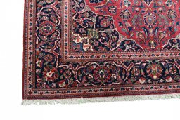 Corner detail of 1930s Kashan rug showing border pattern and Cork pile