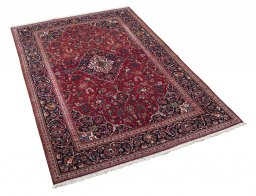 Corner detail of 1930s Kashan rug showing border pattern and Cork pile