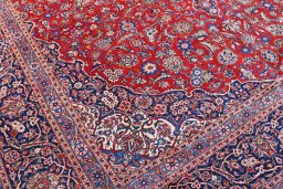 Backside of handmade 1970s Kashan rug showing knot structure and weave density