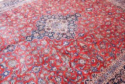 Close-up detail of 1970s Kashan rug from Iran / Persia showing Wool weave