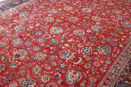 Backside of handmade 1930s Kashan rug showing knot structure and weave density