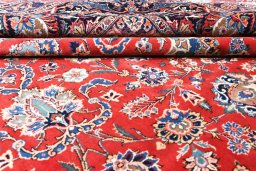 Surface texture of 1930s Kashan rug with natural Wool and intricate pattern