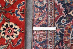 Backside of handmade 1930s Kashan rug showing knot structure and weave density
