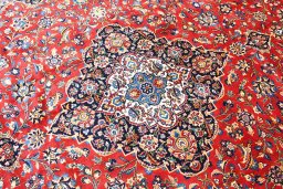 Surface texture of 2000s Kashan rug with natural Wool and intricate pattern