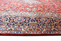 Backside of handmade 2000s Kashan rug showing knot structure and weave density