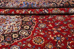 Corner detail of 2000s Kashan rug showing border pattern and Wool pile