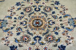 Corner detail of 2000s Kashan rug showing border pattern and Wool pile
