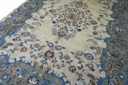 Surface texture of 2000s Kashan rug with natural Wool and intricate pattern