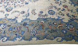 Backside of handmade 2000s Kashan rug showing knot structure and weave density