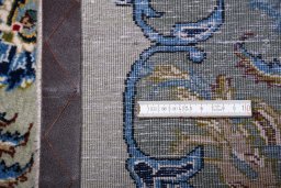 Corner detail of 2000s Kashan rug showing border pattern and Wool pile