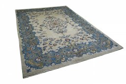 Corner detail of 2000s Kashan rug showing border pattern and Wool pile