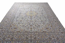 Surface texture of 2000s Kashan rug with natural Wool and intricate pattern