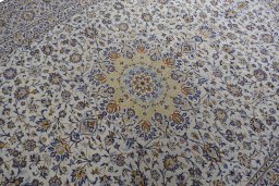 Backside of handmade 2000s Kashan rug showing knot structure and weave density