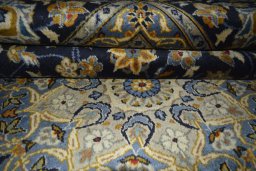 Close-up detail of 2000s Kashan rug from Iran / Persia showing Wool weave