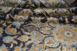 Close-up detail of 2000s Kashan rug from Iran / Persia showing Wool weave