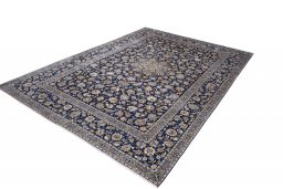 Corner detail of 2000s Kashan rug showing border pattern and Wool pile