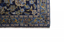 Close-up detail of 2000s Kashan rug from Iran / Persia showing Wool weave