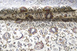 Close-up detail of 2000s Kashan rug from Iran / Persia showing Wool weave