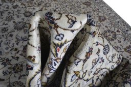 Surface texture of 2000s Kashan rug with natural Wool and intricate pattern
