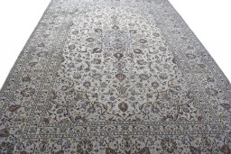 Surface texture of 2000s Kashan rug with natural Wool and intricate pattern