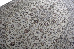 Backside of handmade 2000s Kashan rug showing knot structure and weave density