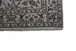 Close-up detail of 2000s Kashan rug from Iran / Persia showing Wool weave
