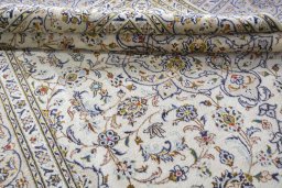Close-up detail of 2000s Kashan rug from Iran / Persia showing Wool weave