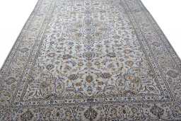 Surface texture of 2000s Kashan rug with natural Wool and intricate pattern