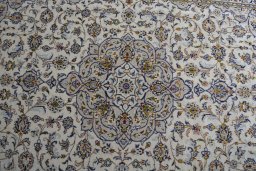 Central medallion detail of 2000s Kashan rug from Iran / Persia