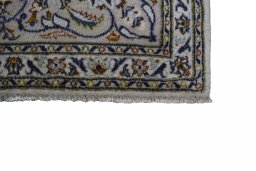 Close-up detail of 2000s Kashan rug from Iran / Persia showing Wool weave