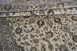 Close-up detail of 2000s Kashan rug from Iran / Persia showing Wool weave