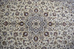 Central medallion detail of 2000s Kashan rug from Iran / Persia