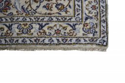 Close-up detail of 2000s Kashan rug from Iran / Persia showing Wool weave