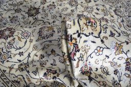 Close-up detail of 2000s Kashan rug from Iran / Persia showing Wool weave