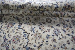 Close-up detail of 2000s Kashan rug from Iran / Persia showing Wool weave