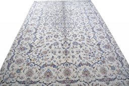 Surface texture of 2000s Kashan rug with natural Wool and intricate pattern