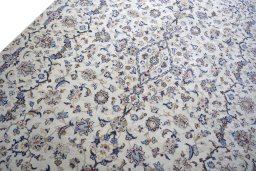 Backside of handmade 2000s Kashan rug showing knot structure and weave density