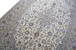 Backside of handmade 2000s Kashan rug showing knot structure and weave density