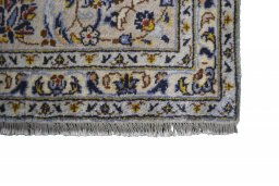 Close-up detail of 2000s Kashan rug from Iran / Persia showing Wool weave