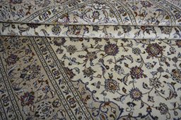 Close-up detail of 2000s Kashan rug from Iran / Persia showing Wool weave