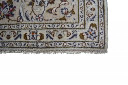 Close-up detail of 2000s Kashan rug from Iran / Persia showing Wool weave