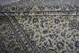 Close-up detail of 2000s Kashan rug from Iran / Persia showing Wool weave