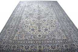 Surface texture of 2000s Kashan rug with natural Wool and intricate pattern