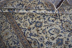 Close-up detail of 2000s Kashan rug from Iran / Persia showing Wool weave