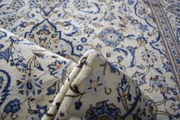 Surface texture of 2000s Kashan rug with natural Wool and intricate pattern