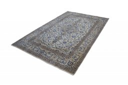 Corner detail of 2000s Kashan rug showing border pattern and Wool pile