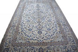 Surface texture of 2000s Kashan rug with natural Wool and intricate pattern